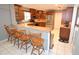 Kitchen with stainless steel appliances, wood cabinets, and a breakfast bar at 2646 Handley Blvd, Lakeland, FL 33803