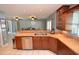 Kitchen features stainless steel appliances, wood cabinets, and a double sink at 2646 Handley Blvd, Lakeland, FL 33803