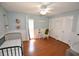 Bedroom with crib, rocking chair, and wood floors at 2646 Handley Blvd, Lakeland, FL 33803