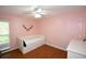 Bedroom with day bed, wood floors and ceiling fan at 2646 Handley Blvd, Lakeland, FL 33803