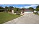 Single-story house with a large yard and a white garage door at 2646 Handley Blvd, Lakeland, FL 33803