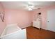 Pink bedroom with day bed, dresser, and wood floors at 2646 Handley Blvd, Lakeland, FL 33803