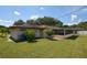 Backyard with screened patio and landscaping at 2646 Handley Blvd, Lakeland, FL 33803