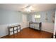 Bedroom with crib, storage, and wood floors at 2646 Handley Blvd, Lakeland, FL 33803
