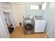 Laundry room with washer, dryer, and storage at 2646 Handley Blvd, Lakeland, FL 33803