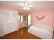 Light pink bedroom with day bed and wood floors at 2646 Handley Blvd, Lakeland, FL 33803