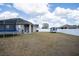 Large backyard with a trampoline and white vinyl fence at 4722 Harts Brook Ln, Mulberry, FL 33860