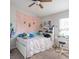 Cozy bedroom with a full-size bed and built-in shelving at 4722 Harts Brook Ln, Mulberry, FL 33860