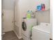 Laundry room with washer, dryer, and extra storage at 4722 Harts Brook Ln, Mulberry, FL 33860