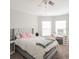 Spacious bedroom with a queen-size bed and ample natural light at 4722 Harts Brook Ln, Mulberry, FL 33860