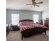 Primary bedroom with king-size bed and ensuite bathroom access at 4722 Harts Brook Ln, Mulberry, FL 33860