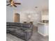 Spacious living room with gray sectional sofa at 4722 Harts Brook Ln, Mulberry, FL 33860