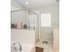 Bathroom with shower, tub, and updated fixtures at 4722 Harts Brook Ln, Mulberry, FL 33860