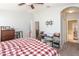 Primary bedroom with king-size bed and access to bathroom and other rooms at 4722 Harts Brook Ln, Mulberry, FL 33860