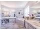 Spa-like bathroom with double vanity, soaking tub, and separate shower at 141 Minniehaha Cir, Haines City, FL 33844