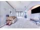 Spacious living room with a brown sofa and gray carpet at 141 Minniehaha Cir, Haines City, FL 33844