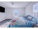 Bright bedroom with king-size bed, large window, and neutral decor at 141 Minniehaha Cir, Haines City, FL 33844