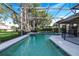 Inviting screened pool with spa and ample deck space at 141 Minniehaha Cir, Haines City, FL 33844