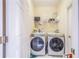 Laundry room with washer, dryer, and shelving at 141 Minniehaha Cir, Haines City, FL 33844