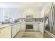 Modern kitchen with stainless steel appliances and granite countertops at 141 Minniehaha Cir, Haines City, FL 33844