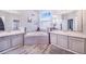 Double vanity bathroom with soaking tub and tiled floors at 141 Minniehaha Cir, Haines City, FL 33844