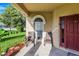 Relaxing front porch with two wicker chairs at 141 Minniehaha Cir, Haines City, FL 33844