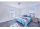 Bedroom with queen bed and ocean-themed bedding at 141 Minniehaha Cir, Haines City, FL 33844