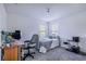Bedroom with double bed, workspace, and ample natural light at 141 Minniehaha Cir, Haines City, FL 33844