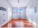 Simple dining room with hardwood floors and arched window at 141 Minniehaha Cir, Haines City, FL 33844