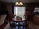 Bright dining area with round table and four chairs, view to backyard at 600 Sunway Ln, Winter Haven, FL 33880