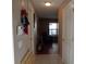 Long hallway with tiled floor and access to other rooms at 600 Sunway Ln, Winter Haven, FL 33880
