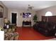 Living room with brown sofas and a large flat-screen TV at 600 Sunway Ln, Winter Haven, FL 33880