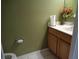 Simple bathroom with wood vanity and single sink at 600 Sunway Ln, Winter Haven, FL 33880
