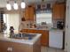 Kitchen with island, stainless steel sink, and dishwasher at 600 Sunway Ln, Winter Haven, FL 33880