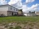 Large backyard with above ground pool and patio furniture at 600 Sunway Ln, Winter Haven, FL 33880