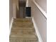 Carpeted staircase leading to the upper level at 600 Sunway Ln, Winter Haven, FL 33880