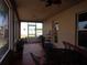 Relaxing screened porch with table and chairs, overlooking backyard at 600 Sunway Ln, Winter Haven, FL 33880