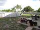 Above ground pool with patio furniture, fire pit, and fenced yard at 600 Sunway Ln, Winter Haven, FL 33880