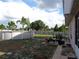 Above ground pool with patio furniture and fenced backyard at 600 Sunway Ln, Winter Haven, FL 33880