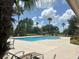 Inviting community pool with lounge chairs at 574 Loblolly Pl, Auburndale, FL 33823