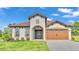 One-story home with a two-car garage and attractive landscaping at 574 Loblolly Pl, Auburndale, FL 33823