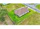 Single-story house, brown tile roof, green lawn at 574 Loblolly Pl, Auburndale, FL 33823
