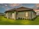 One story home with sliding glass doors leading to the backyard at 574 Loblolly Pl, Auburndale, FL 33823