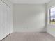 Spacious bedroom with double door closet and large window at 574 Loblolly Pl, Auburndale, FL 33823