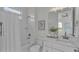 Clean bathroom with white subway tiles, bathtub, and vanity at 574 Loblolly Pl, Auburndale, FL 33823