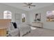 Spacious bedroom with large windows, ceiling fan, and dresser at 574 Loblolly Pl, Auburndale, FL 33823