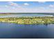 Aerial view of lakefront community with many houses at 574 Loblolly Pl, Auburndale, FL 33823