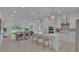 Open concept kitchen with white cabinets, stainless steel appliances, and a large island at 574 Loblolly Pl, Auburndale, FL 33823