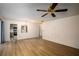 Spacious living room with light wood flooring and ceiling fan at 832 S Hill Ave # 10, Deland, FL 32724