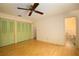Bedroom with light wood floors, ceiling fan, and built-in closets at 832 S Hill Ave # 10, Deland, FL 32724